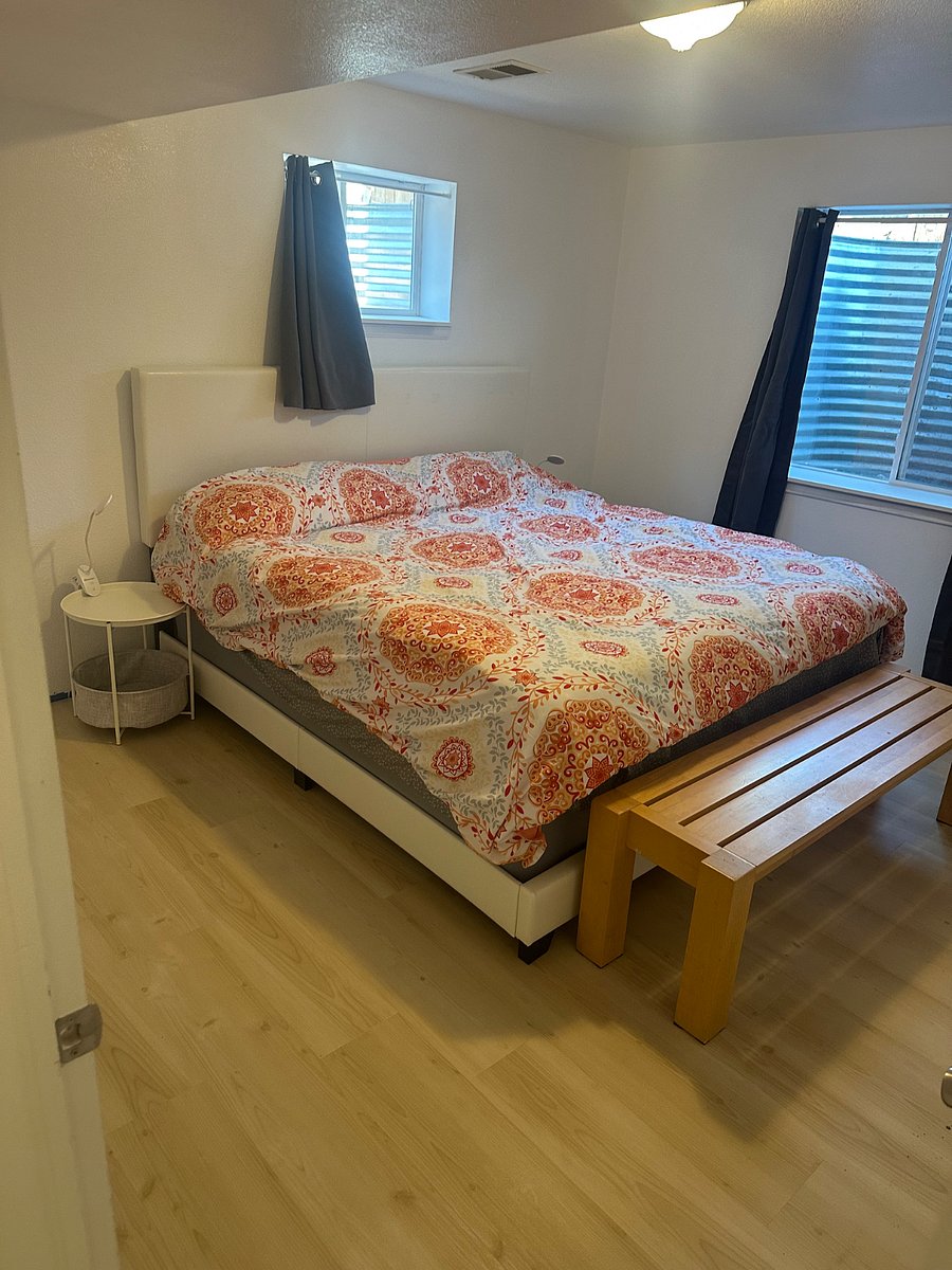 One of two bedrooms.  Side table tops are removable trays.  Room has large walk-in closet. 