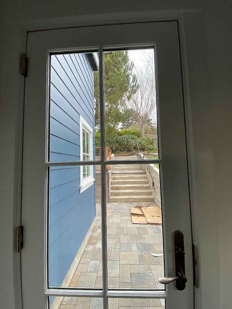 View to back patio and yard from utility/mixed use room