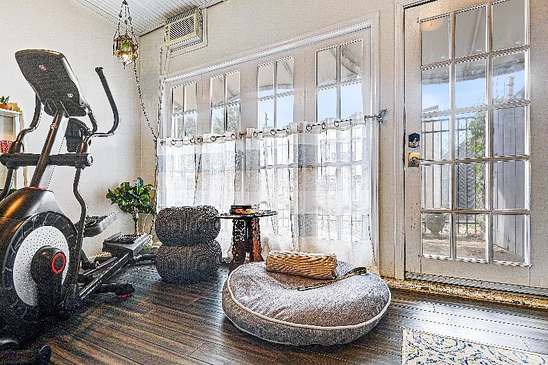 Exercise room leads out to backyard and basement. 

