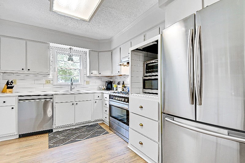 New quartz counters + hardwood floors.