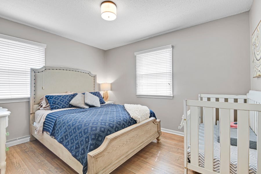 Front bedroom with queen size bed, double closet and crib.

