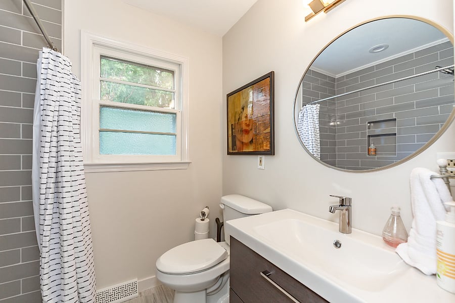 Hall bathroom is updated with tile flooring + new shower with glass doors. 