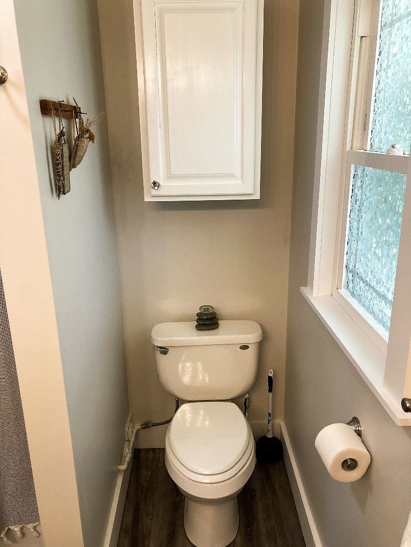 Cabinet above toilet with extra towels