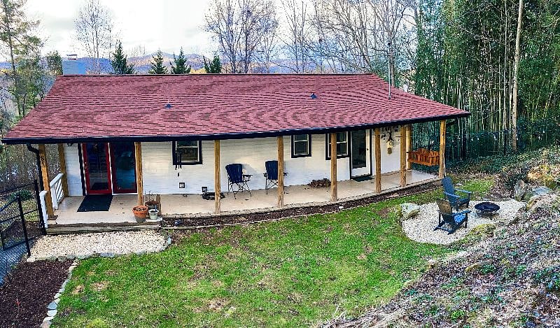 Front of the home and mountain view from above.