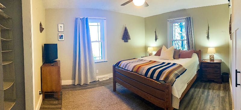 Main bedroom with queen sized bed and two closets
