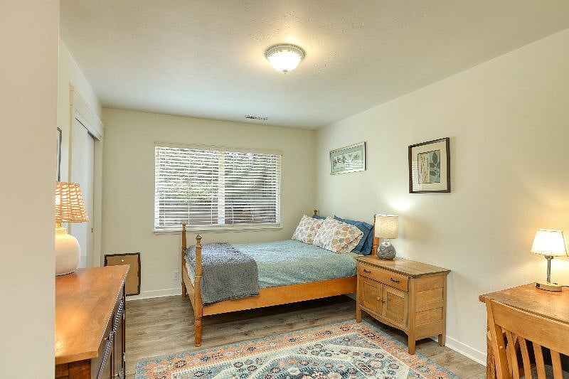 Guest bedroom with doggie door and full size bed with memory foam mattress