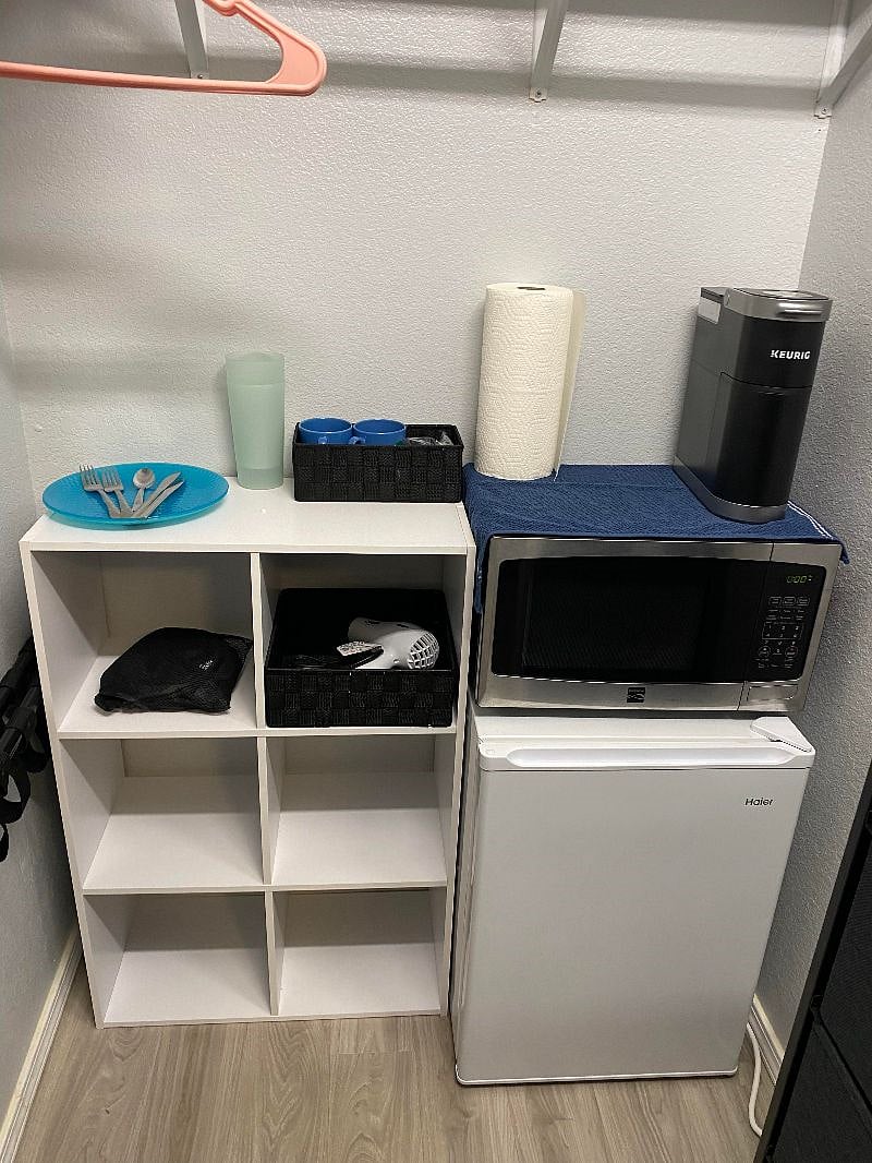 Mini fridge, microwave, Keurig, plates, utensils, hair dryer, laundry hamper.