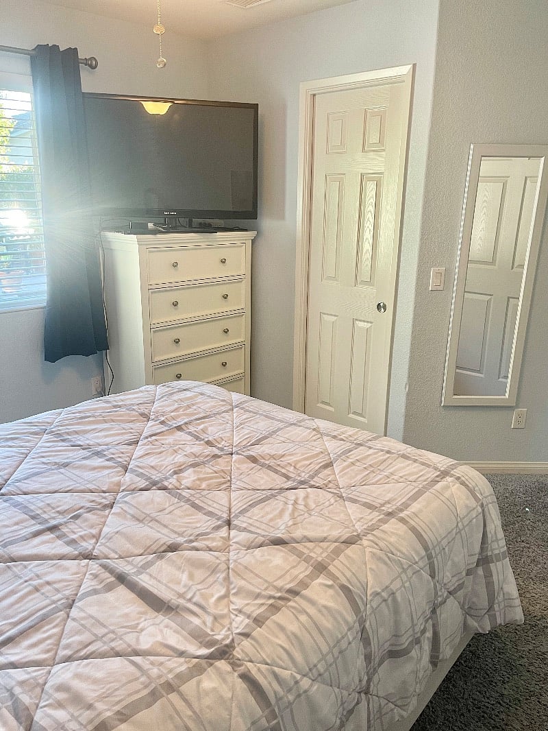 Bedroom chest of drawers and walk in closet. 