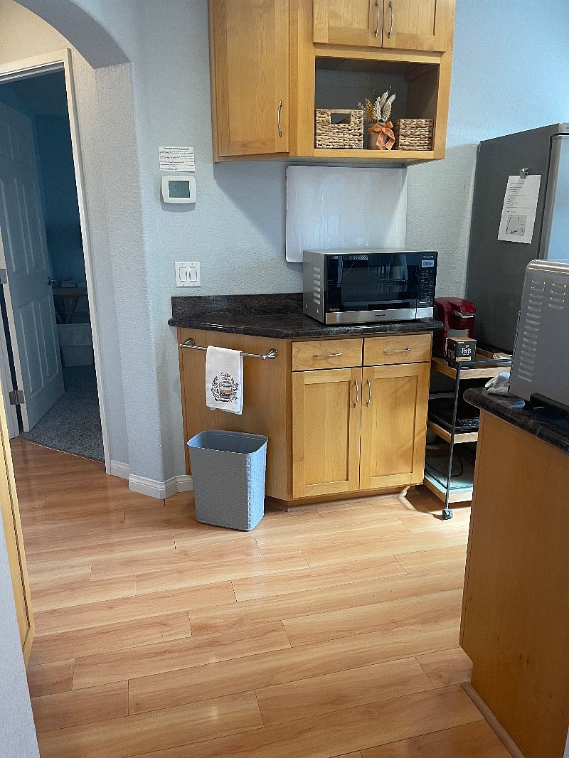 Kitchenette- microwave, full refrigerator, Keurig, and induction frying burner. 