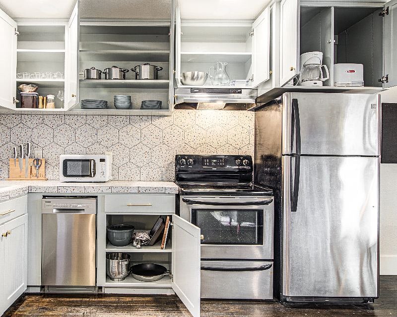 Coffee, half and half, salt/pepper/sugar. Pots, pans, frying pan. Plenty of cooking utensils. Electric kettle, toaster. Over-the-sink dish drainer for smaller jobs.