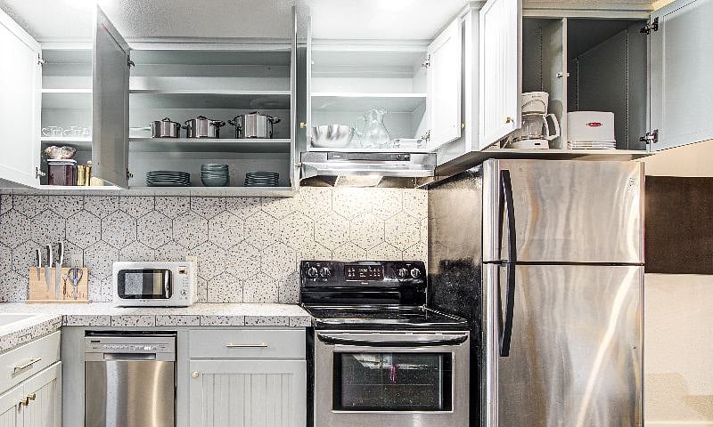 Coffee, half and half, salt/pepper/sugar. Pots, pans, frying pan. Plenty of cooking utensils. Electric kettle, toaster. Over-the-sink dish drainer for smaller jobs.