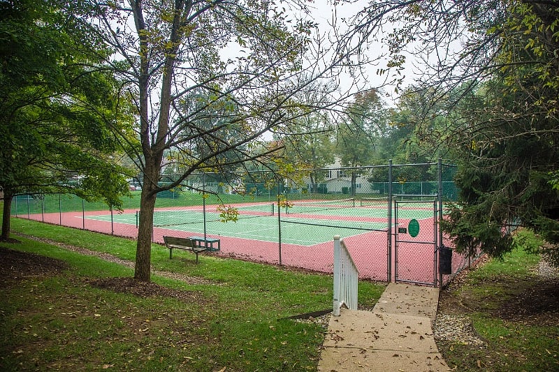 Two outdoor tennis courts and one pickle ball court