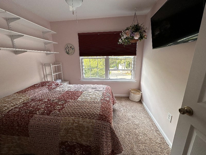smaller room with wall mounted TV