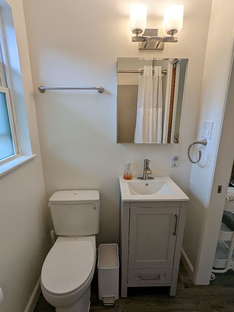 New Toto toilet, new vanity and medicine cabinet.