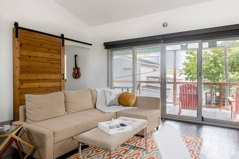 Open floorplan. Barn door leads to bedroom.