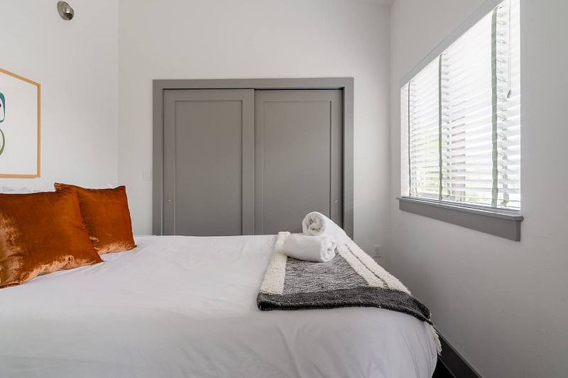 Closet is double-hung with storage shelves.