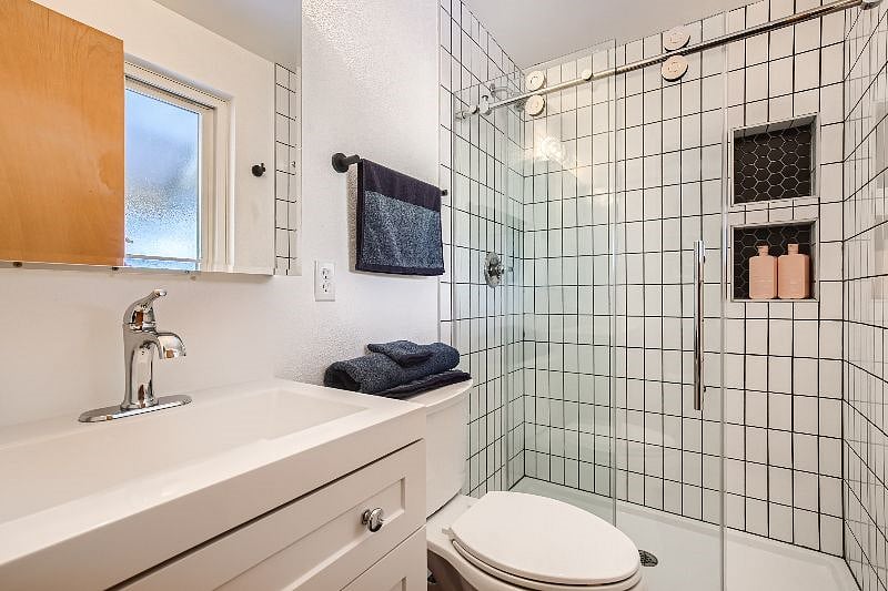 Brand new remodeled private bathroom with glass sliding door.