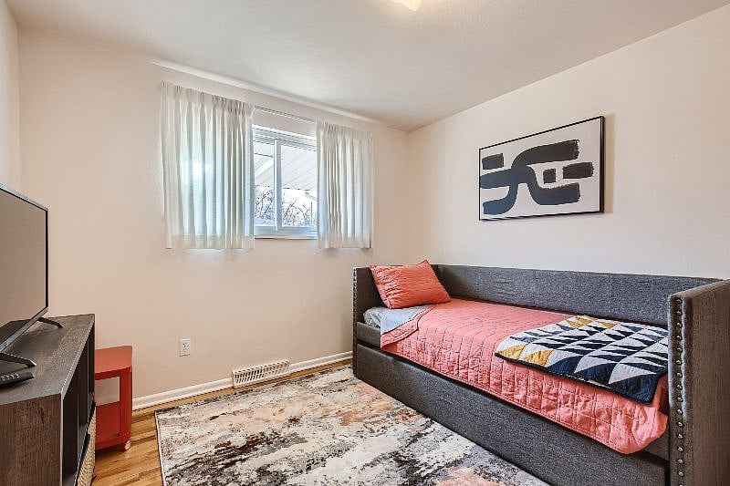 Third room, complete with trundle bed tucked away, plus Smart TV, closet space and cubbies for storage.