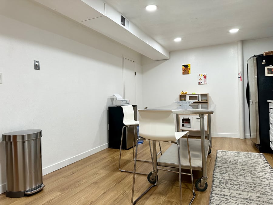 Spacious kitchen with new stove and flooring. Door in this photo leads to a good sized pantry for additional food storage!