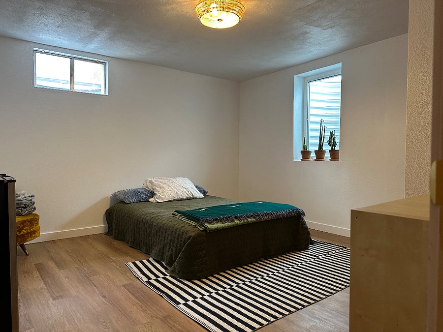 Second bedroom, large enough to fit full (shown here), queen, or king sized bed. Egress window offers plenty of natural light and emergency exit access. Also includes closet space.  Egress in both rooms are facing east, or west.