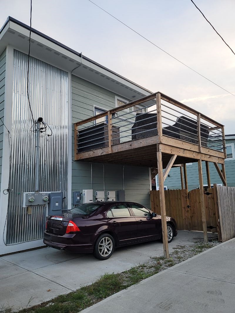 View from Neighbors side - you park where the maroon car is currently parked. We have had contractors back in and park their full sized pickup trucks.