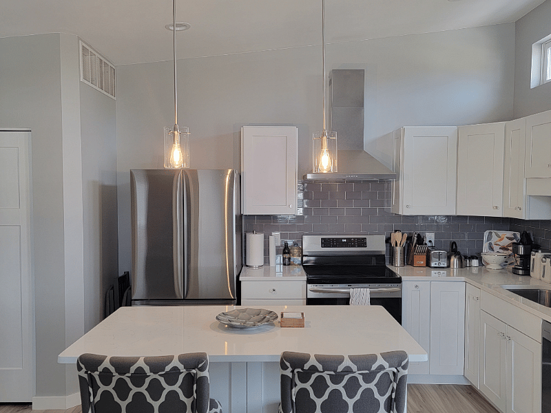 Eat in kitchen stocked with all the cooking utensils you might need and cooking basics like spices and oils. Enjoy tea, coffee or hot chocolate. Microwave is in opposite side of island for easy access.