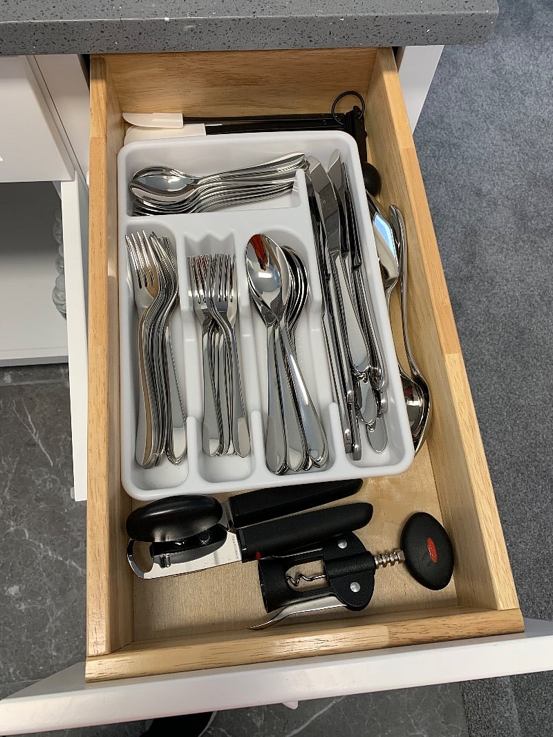 Silverware, can opener, wine opener, measuring spoons, mixing spatulas