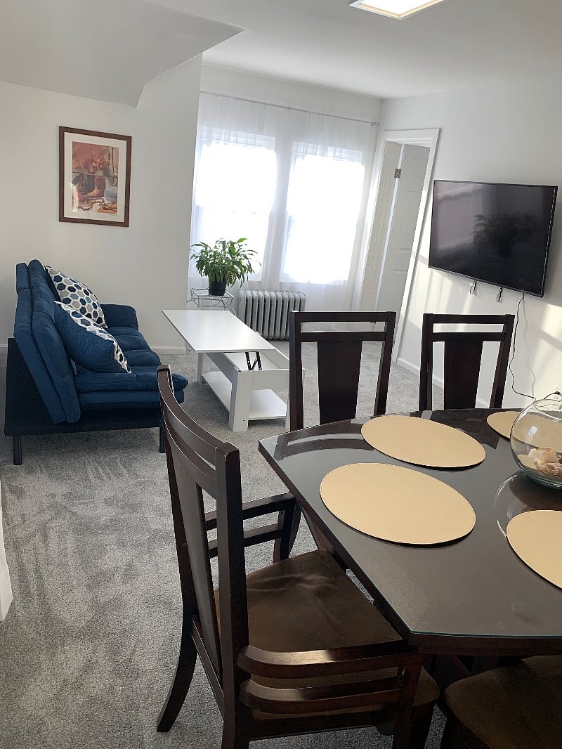 Dining Room / Living Room with TV across from the couch.
