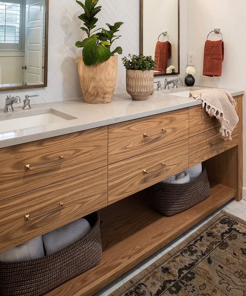 Recently remodeled primary bathroom with marble walk-in shower with rain head and regular shower head.