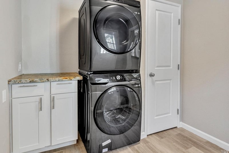 The laundry room with a new washer & dryer. This is the only shared space between the 2 units but you'll have your choice of 4 laundry days per week to avoid any annoyances.