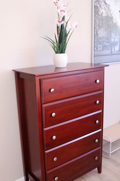 Plenty of storage space for your belongings in 2 dressers and an armoire. 