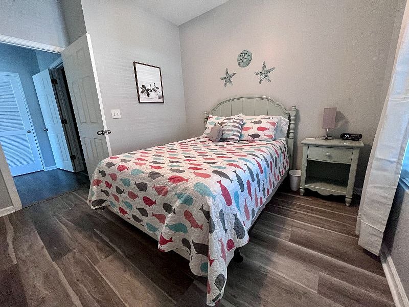 The second bedroom has plenty of space and features a full-size bed.