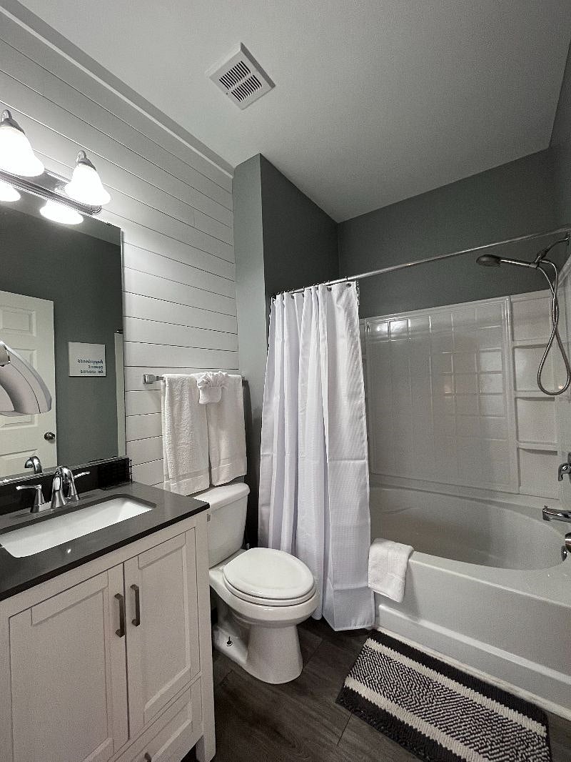 Updated private en suite bath off the master bedroom with oversized soaker tub/shower combo.