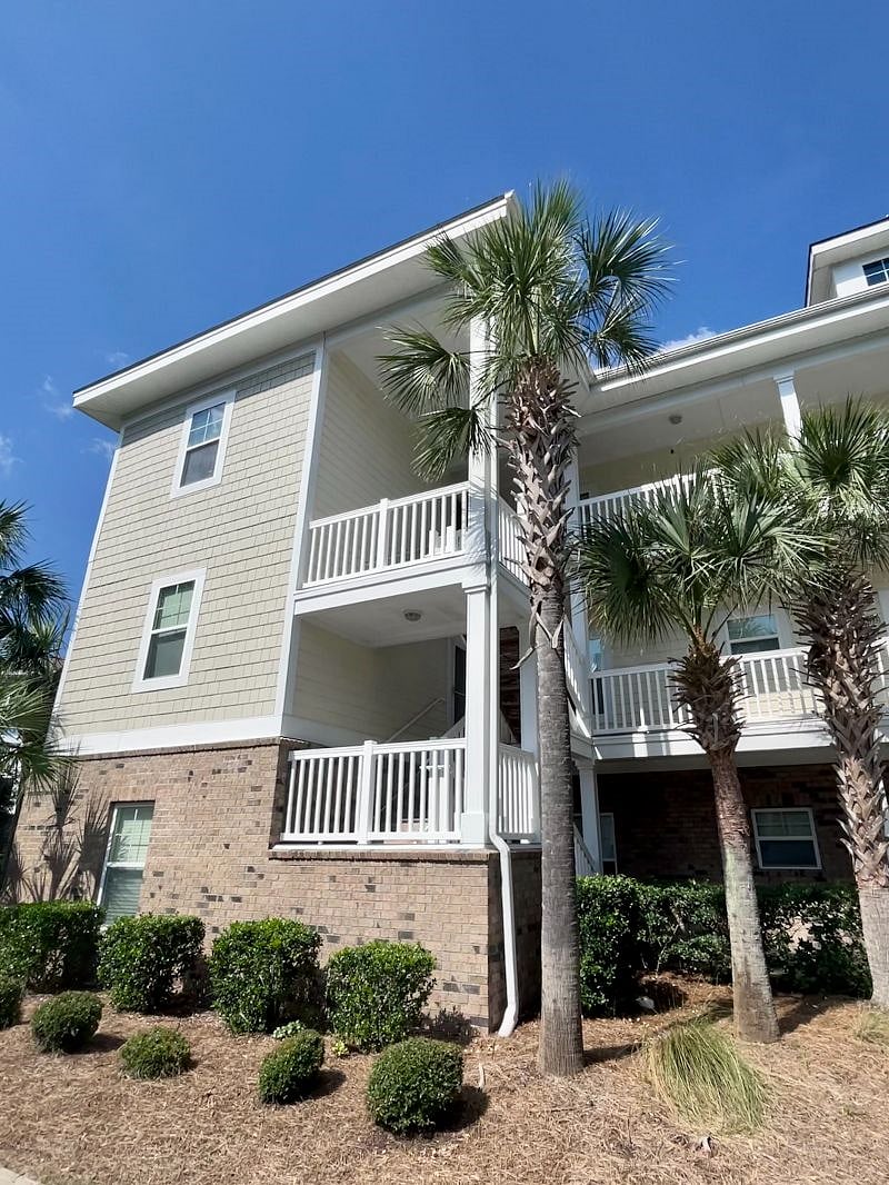 Condo is a third floor walk-up, end unit with vaulted ceilings, and a balcony overlooking the pond/fountain.
