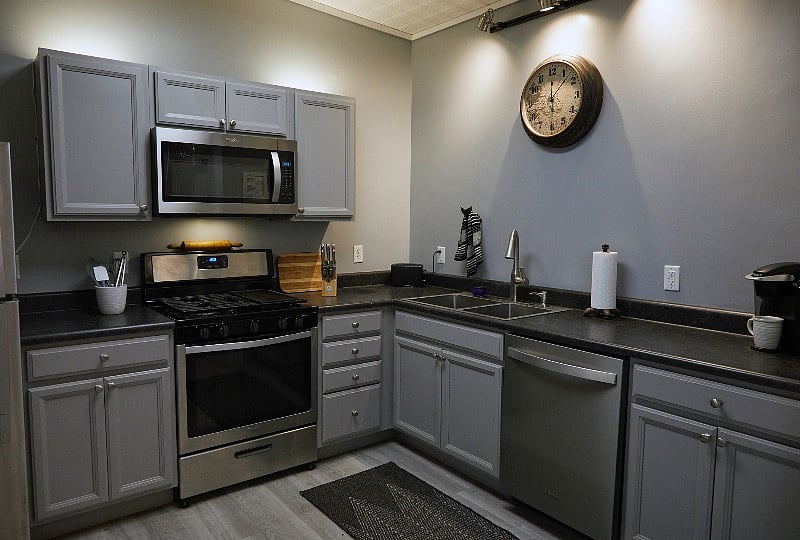 Updated kitchen with full-sized refrigerator, dishwasher, stove/microwave, dishes, cutlery, glassware and more.