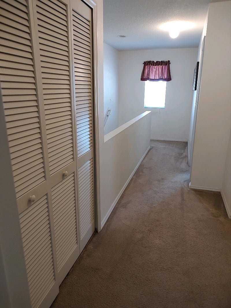 Hall upstairs showing W/D closet 