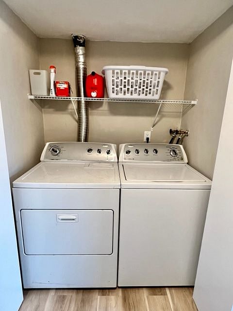 Washer and dryer just off the main hallway, tucked behind double doors