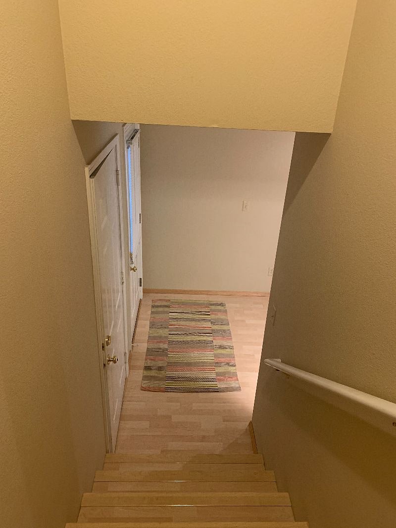 Garage and front door at foot of staircase