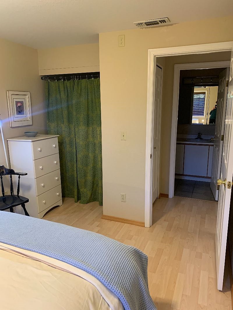 Chest of drawers and hanging closet in ground floor bedroom