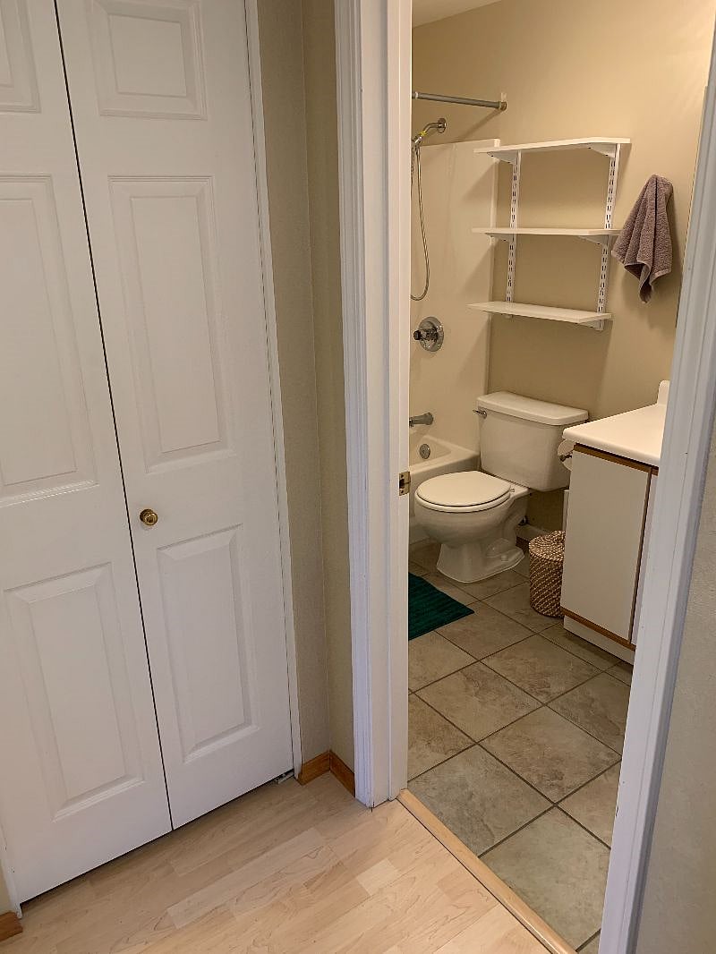 Ground floor linen cupboard or storage space, with entrance to full bathroom