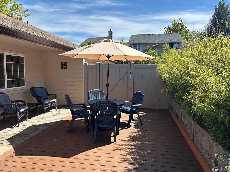 Own private patio with sun umbrella, dining table and chairs.