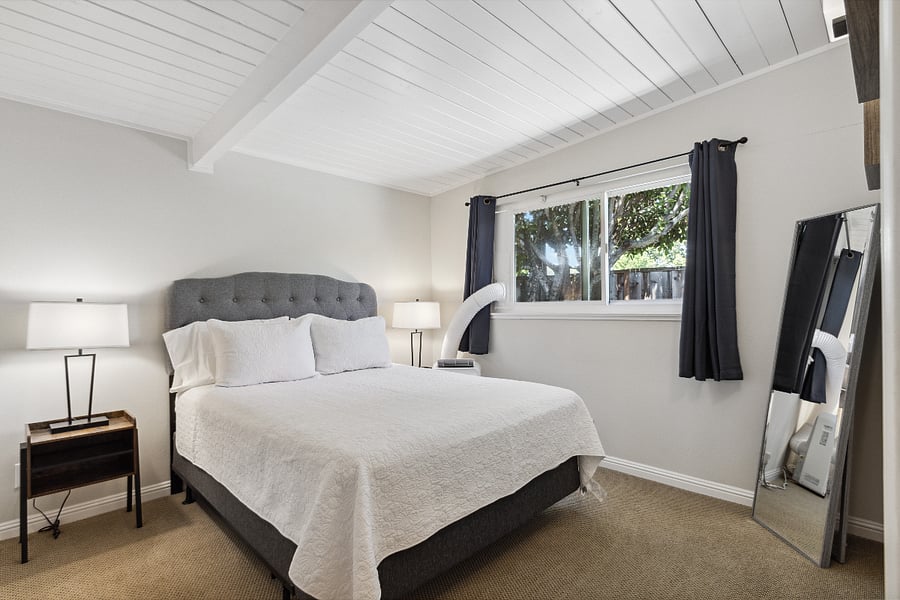 Bedroom with blackout curtains and air conditioning