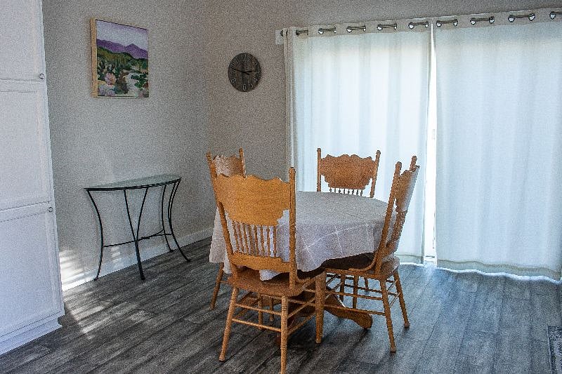 Dining table with sliding door that will open up to deck.
