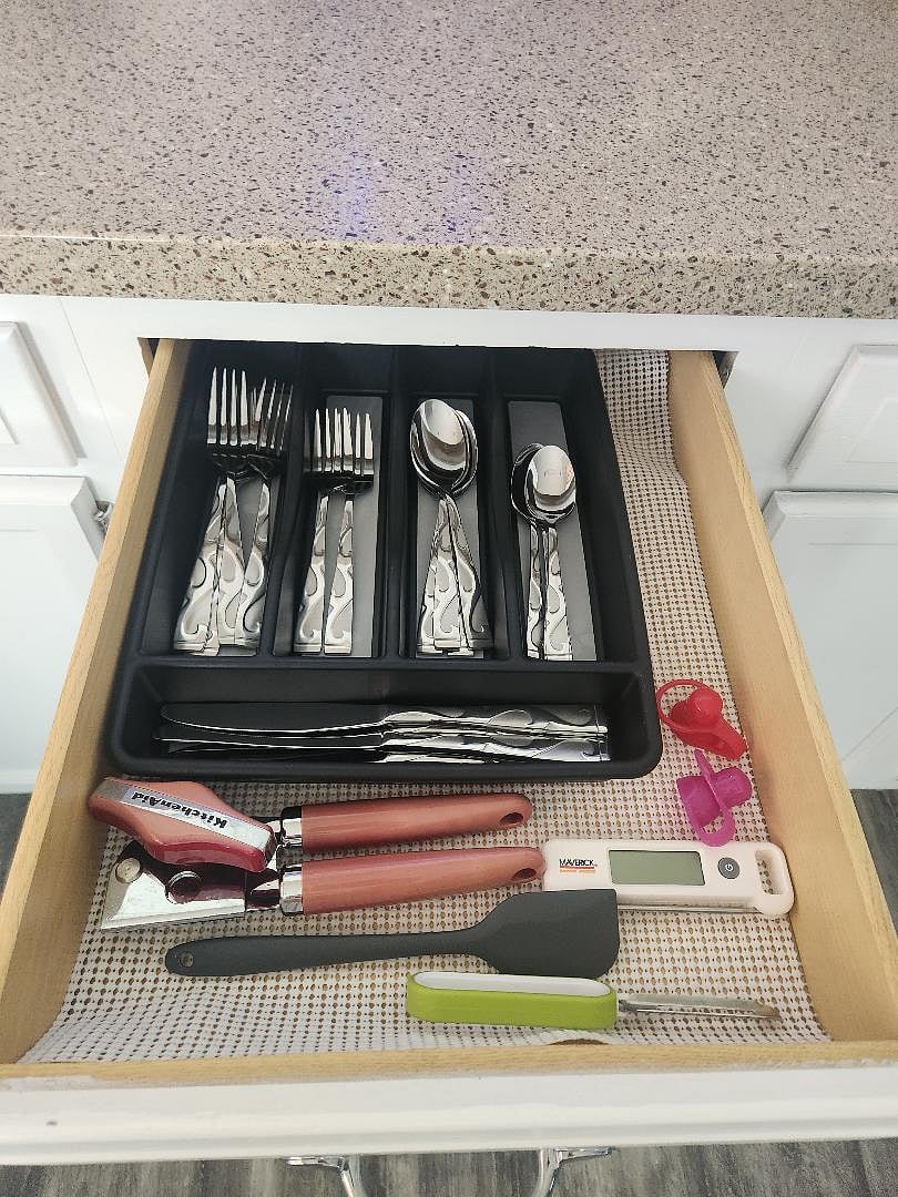 Kitchen cookware: meat thermometer, can opener, utensils
