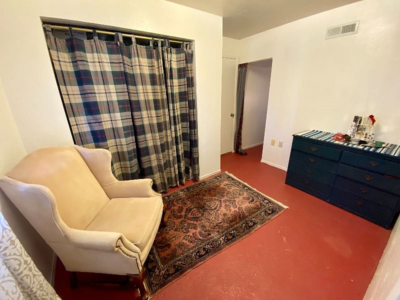 Spare bedroom/office with hall to the other bedroom.