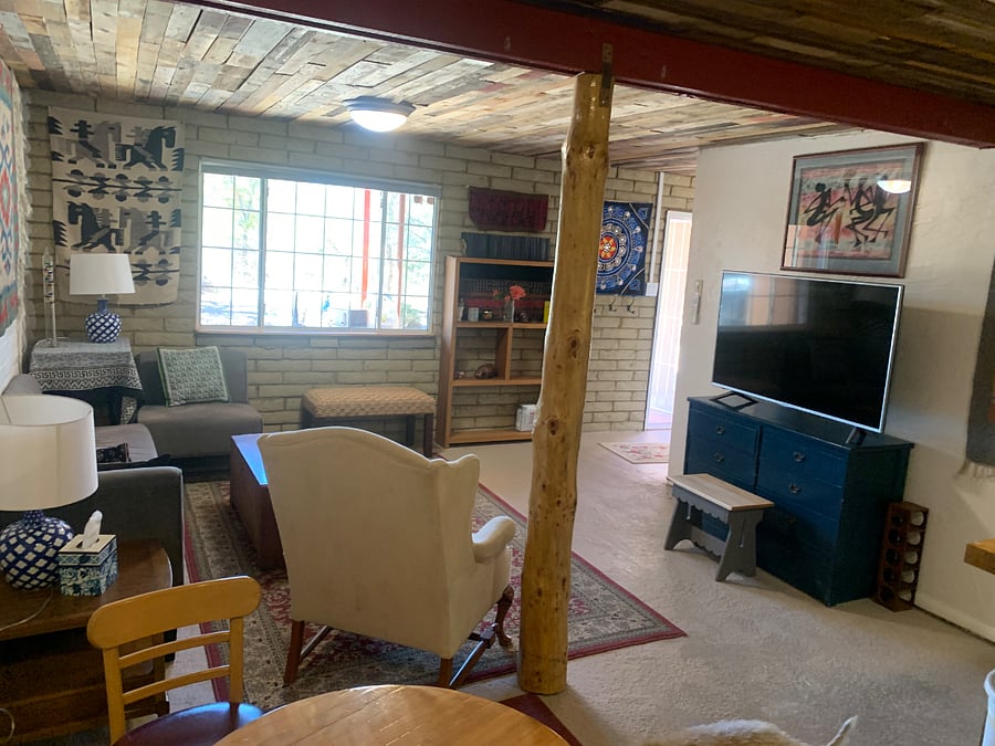 Living room w smart tv and picture window.