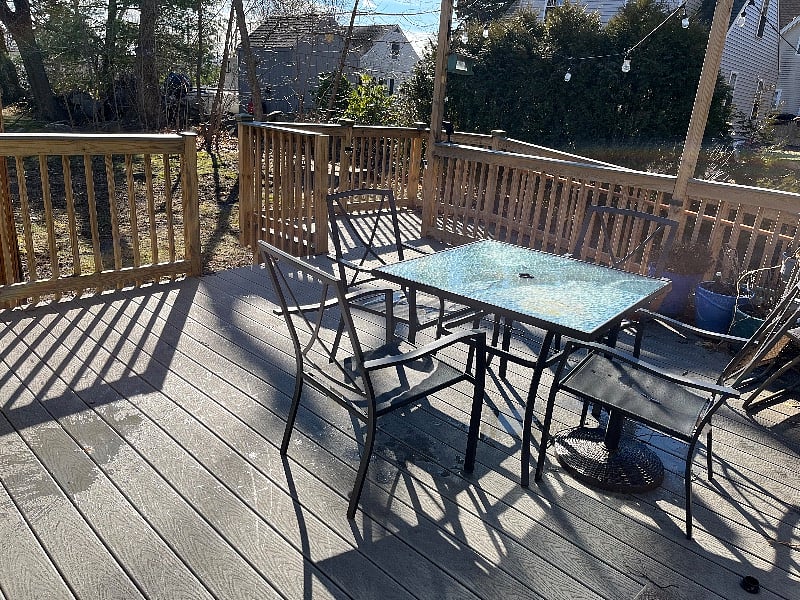 Back Porch mostly Sunny. Umbrella and outdoor cushions provided. 