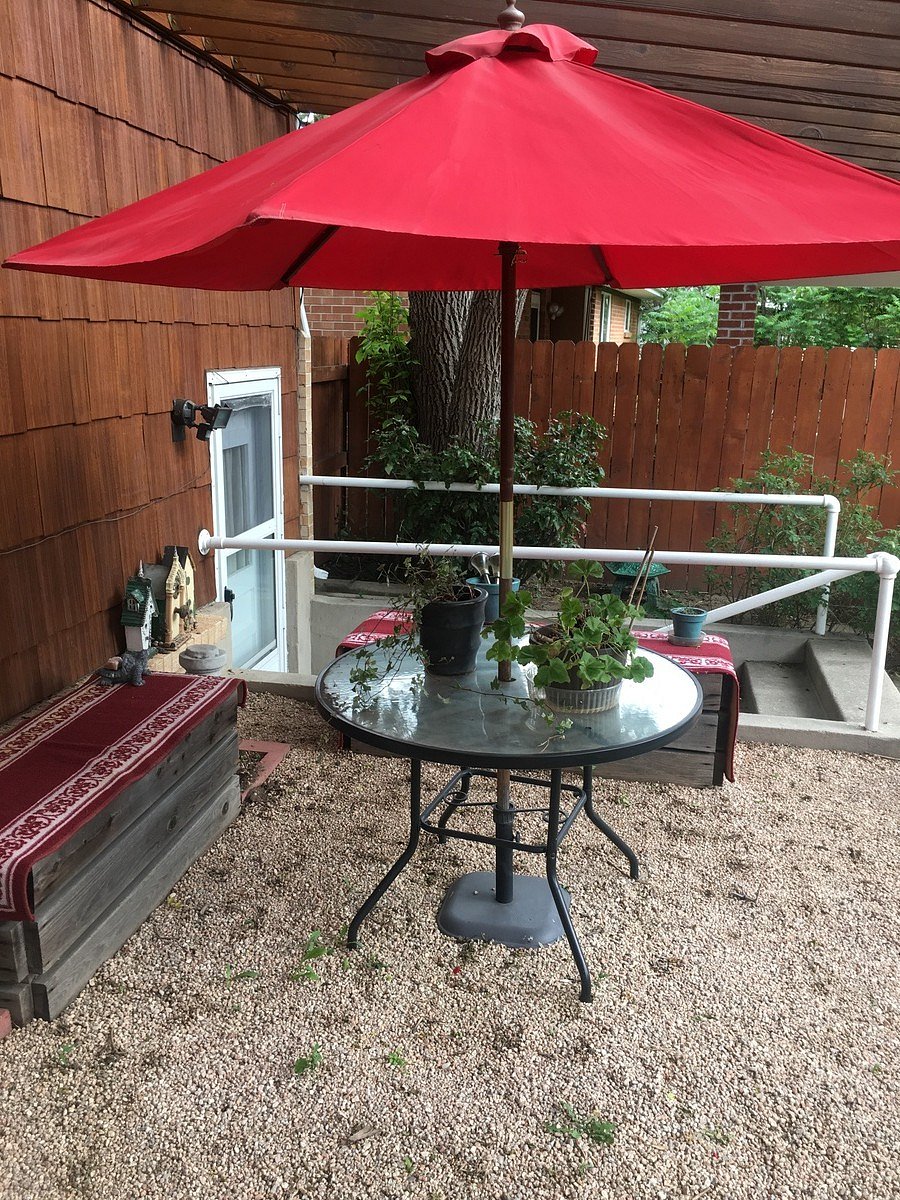 view of patio and stairway to the apartment.