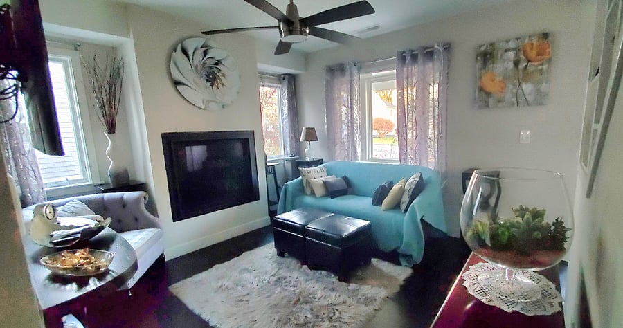 Quaint, cozy living room with fireplace.