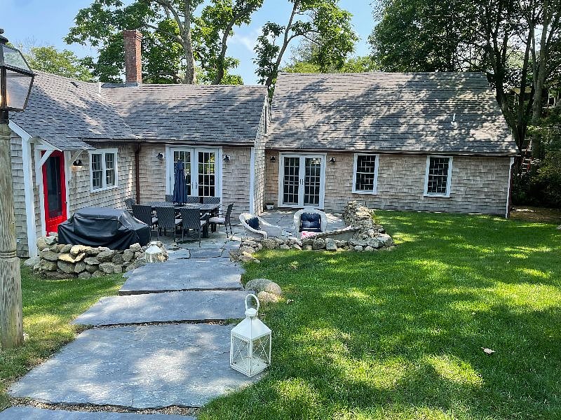The walkway leading from the driveway to the back patio. This outdoor space is private and enjoyable on milder days.